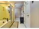 Bathroom featuring glass enclosed shower, neutral color palette, and tile flooring at 965 Sundew Se Dr, Conyers, GA 30013