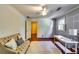 Bedroom with hardwood floors, gray accent wall, window, and neutral color palette at 965 Sundew Se Dr, Conyers, GA 30013