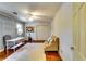 Bedroom featuring hardwood floors, ceiling fan, closet, and gray accent wall at 965 Sundew Se Dr, Conyers, GA 30013
