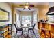 Charming breakfast nook features a round table, chairs, and a window view of the outdoors at 965 Sundew Se Dr, Conyers, GA 30013
