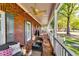 Charming porch with a brick floor, seating area and white railing offering a relaxing outdoor space at 965 Sundew Se Dr, Conyers, GA 30013