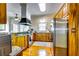 The kitchen features wooden cabinetry, granite counters, and stainless steel appliances at 965 Sundew Se Dr, Conyers, GA 30013
