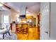 Warm kitchen with wooden cabinetry, a breakfast bar, stainless steel appliances, and hardwood floors at 965 Sundew Se Dr, Conyers, GA 30013