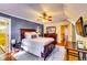 The main bedroom features an ensuite bathroom, ceiling fan, and hardwood floors at 965 Sundew Se Dr, Conyers, GA 30013