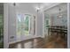 Inviting foyer with hardwood floors, a glass front door, and an adjacent dining room at 2482 Windchase Ct, Buford, GA 30518