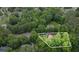 Aerial view of a beautiful, wooded property highlighting its lush landscaping and serene setting at 2482 Windchase Dr, Buford, GA 30518
