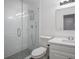 A clean, modern bathroom with a glass shower, toilet, and a vanity with sink at 2482 Windchase Dr, Buford, GA 30518