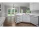 Bright kitchen with white cabinets, stainless steel appliances, and a breakfast nook at 2482 Windchase Dr, Buford, GA 30518