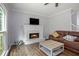 Inviting living room with a fireplace, hardwood floors, and a comfortable couch at 2482 Windchase Dr, Buford, GA 30518