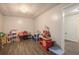 Spacious playroom area featuring durable flooring and neutral walls perfect for various activities at 2482 Windchase Dr, Buford, GA 30518