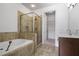 Well-lit bathroom featuring a soaking tub, glass shower, and tile flooring at 326 Roswell Se St # 508, Marietta, GA 30060