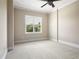 Cozy bedroom featuring neutral carpet, natural light from the window, and a ceiling fan, offering a calming space at 326 Roswell Se St # 508, Marietta, GA 30060