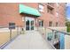 Inviting brick building entrance with green awning and ramp access provides a welcoming feel at 326 Roswell Se St # 508, Marietta, GA 30060