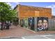 Brick building exterior featuring vibrant art installations along the sidewalk, adding a creative touch to the neighborhood at 326 Roswell Se St # 508, Marietta, GA 30060