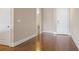 Hallway featuring hardwood flooring, front door, and access to bathroom at 326 Roswell Se St # 508, Marietta, GA 30060
