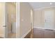 Hallway leading to laundry room with front loading machines and white trim at 326 Roswell Se St # 508, Marietta, GA 30060