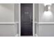Hallway showing the entry door 508, wall trim, and stylish sconce at 326 Roswell Se St # 508, Marietta, GA 30060