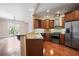 Open kitchen with stainless steel appliances, granite counters, and access to the patio at 326 Roswell Se St # 508, Marietta, GA 30060