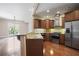 Modern kitchen with stainless steel appliances, wooden cabinets, granite countertops, and sleek backsplash, ideal for cooking at 326 Roswell Se St # 508, Marietta, GA 30060