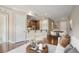 Open-concept living room with hardwood floors, view to kitchen, adjacent dining area at 326 Roswell Se St # 508, Marietta, GA 30060