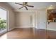 Elegant living room with hardwood floors, neutral decor, crown molding, and a sliding glass door to an outdoor balcony at 326 Roswell Se St # 508, Marietta, GA 30060