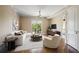 Cozy living room with hardwood floors, neutral paint, sliding glass door, and modern ceiling fan at 326 Roswell Se St # 508, Marietta, GA 30060