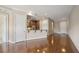 Open living space showcasing hardwood floors, recessed lighting, neutral color palette, and kitchen access at 326 Roswell Se St # 508, Marietta, GA 30060