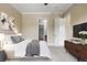 Spacious main bedroom with neutral carpet, a window, a modern dresser and calm decor at 326 Roswell Se St # 508, Marietta, GA 30060