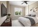 Comfortable main bedroom with neutral carpet, a large window, and calm decor at 326 Roswell Se St # 508, Marietta, GA 30060