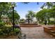 Charming town square featuring a brick-lined fountain, benches, and lush greenery at 326 Roswell Se St # 508, Marietta, GA 30060