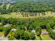 Bird's eye view showcasing the property's proximity to a golf course and surrounding community at 9041 Par Dr, Douglasville, GA 30134