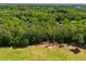Aerial view of lush, mature trees surrounding the property and neighborhood beyond at 9041 Par Dr, Douglasville, GA 30134