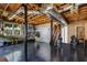 Spacious basement offers storage, with an epoxy floor, exposed duct work, and stairs to upper level at 9041 Par Dr, Douglasville, GA 30134