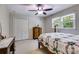 Bedroom with neutral walls, ceiling fan, and carpet at 9041 Par Dr, Douglasville, GA 30134