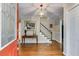 Elegant entryway features hardwood floors, chandelier, staircase, and front door with glass inserts at 9041 Par Dr, Douglasville, GA 30134