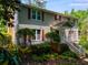 Well-maintained two-story home with lush green landscaping in front at 9041 Par Dr, Douglasville, GA 30134