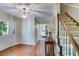 Entryway with hardwood floors, staircase, and plenty of natural light at 9041 Par Dr, Douglasville, GA 30134