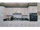 Traditional kitchen design with white cabinets and modern appliances at 9041 Par Dr, Douglasville, GA 30134