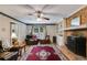 Inviting living room boasting a brick fireplace and hardwood floors at 9041 Par Dr, Douglasville, GA 30134