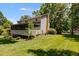 Exterior view of the home featuring a screened porch and well-maintained lawn at 9041 Par Dr, Douglasville, GA 30134