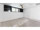 Unfinished basement featuring a small window and built-in shelving at 1909 Winding Creek Sw Ln, Marietta, GA 30064