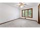 Bedroom with a large window overlooking trees at 1909 Winding Creek Sw Ln, Marietta, GA 30064