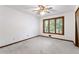 Bedroom with a large window, ceiling fan, and carpeted floor at 1909 Winding Creek Sw Ln, Marietta, GA 30064