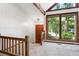 Entryway with a large window and wooden railing at 1909 Winding Creek Sw Ln, Marietta, GA 30064