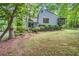 Charming home with unique architectural details surrounded by mature trees at 1909 Winding Creek Sw Ln, Marietta, GA 30064