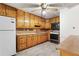 Galley kitchen with knotty pine cabinets and vintage appliances at 1909 Winding Creek Sw Ln, Marietta, GA 30064
