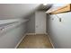Unfinished attic space with shelving units on a gray wall at 625 Chestnut St # D, Atlanta, GA 30354