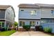 A cozy two-story home with a small backyard and a concrete patio at 625 Chestnut St # D, Atlanta, GA 30354