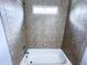 Bathroom featuring tiled shower and tub with shower head at 625 Chestnut St # D, Atlanta, GA 30354