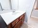 Bathroom vanity featuring a white countertop and wood cabinets at 625 Chestnut St # D, Atlanta, GA 30354